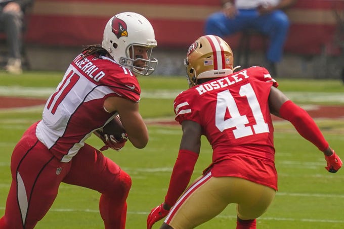 September 13, 2020; Santa Clara, California, USA; Arizona Cardinals wide receiver Larry Fitzgerald (11) runs the football against San Francisco 49ers cornerback Emmanuel Moseley (41) during the first quarter at Levi's Stadium. Mandatory Credit: Kyle Terada-USA TODAY Sports
