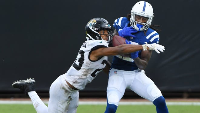 Jaguars cornerback CJ Henderson (23) breaks up a fourth-down pass attempt to Indianapolis Colts wide receiver T.Y. Hilton (13) in the 2020 season opener.
