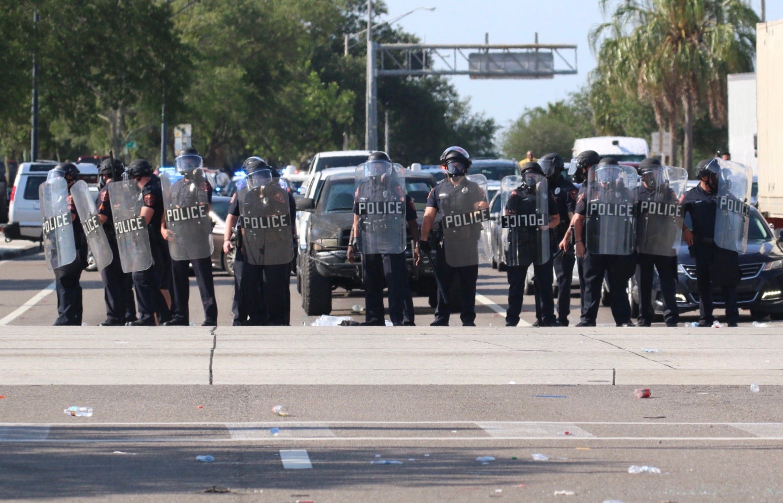 Lakeland police officers stand across the intersection of Memorial Boulevard and Florida Avenue that was blocked by protesters on May 31.