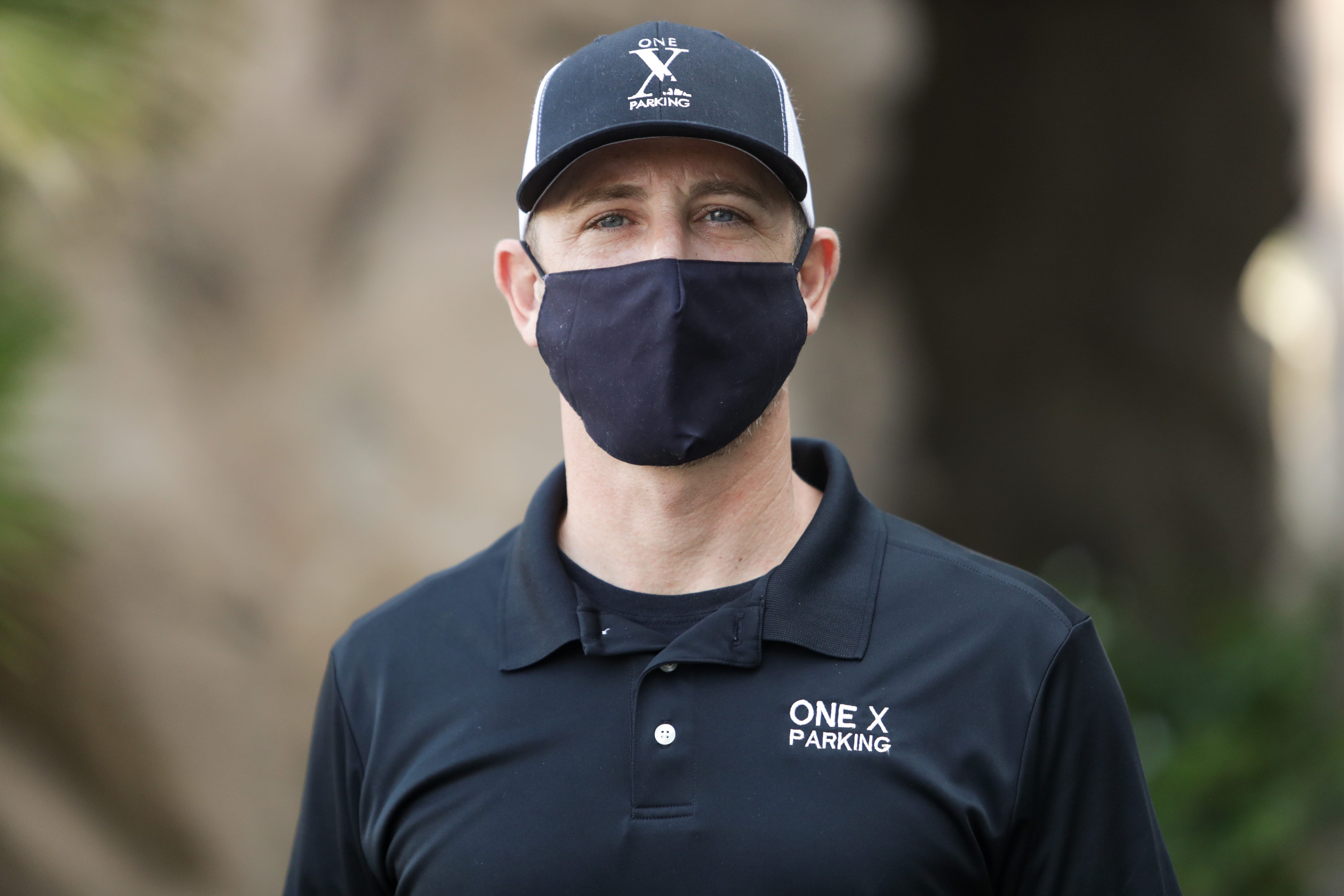 Judd Fox, owner of One X Parking, stands in front of La Quinta Cliffhouse, one of the locations he provided valet services for prior to the COVID-19 pandemic, on Monday, September 14, 2020, in La Quinta, Calif.