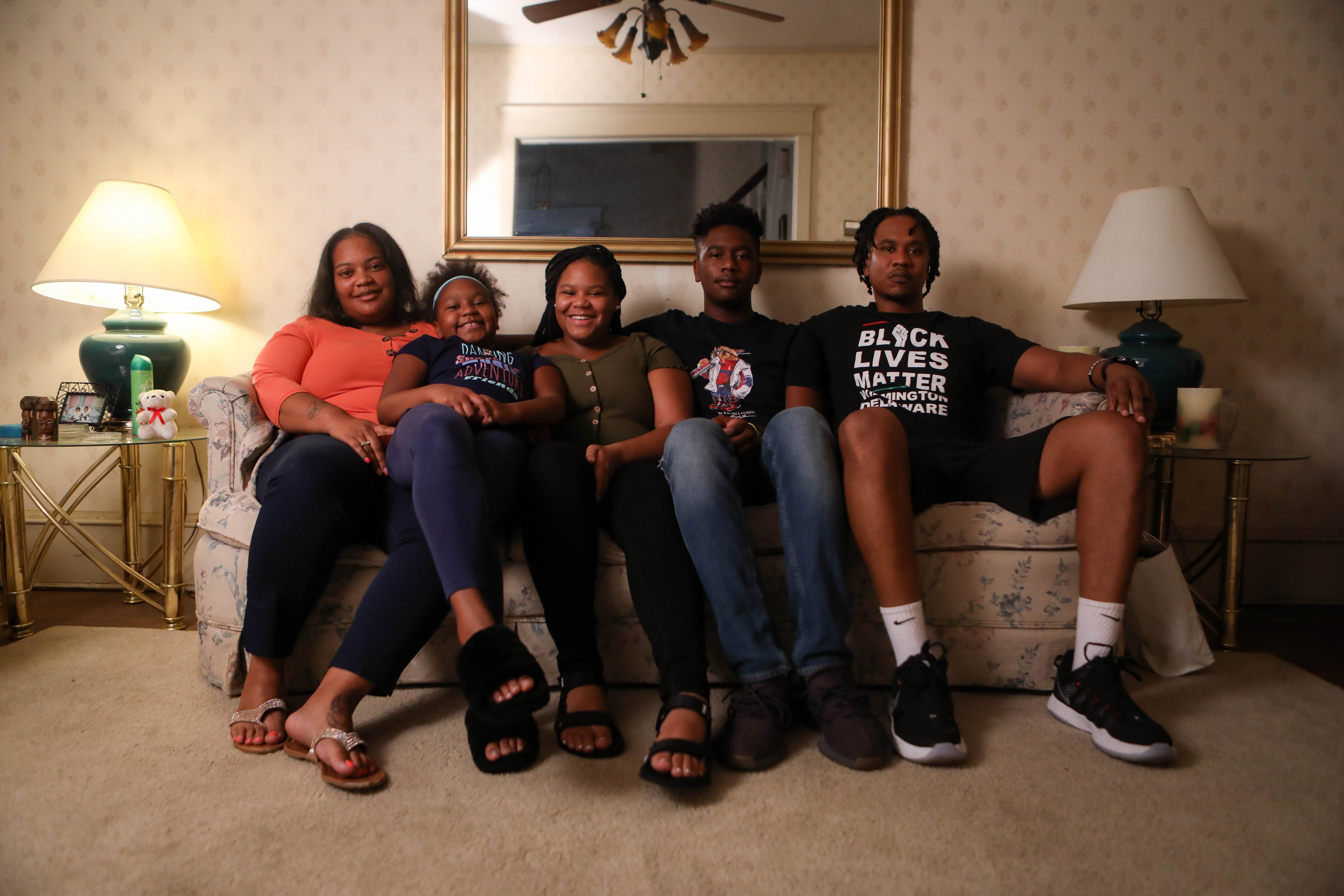 Shamiya Gould (far left) and her family pose for a portrait their Wilmington home on Tuesday, Sept. 1, 2020.