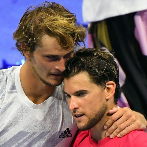 Dominic Thiem (right), celebrates his win over chi
