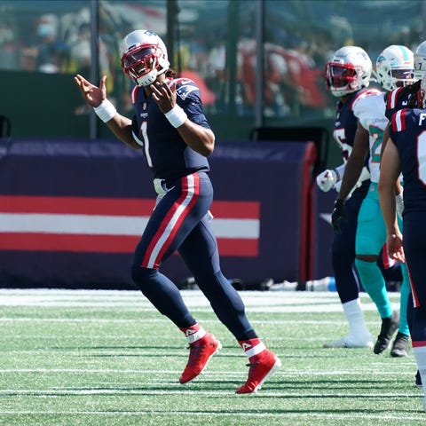 New England Patriots quarterback Cam Newton (1) re