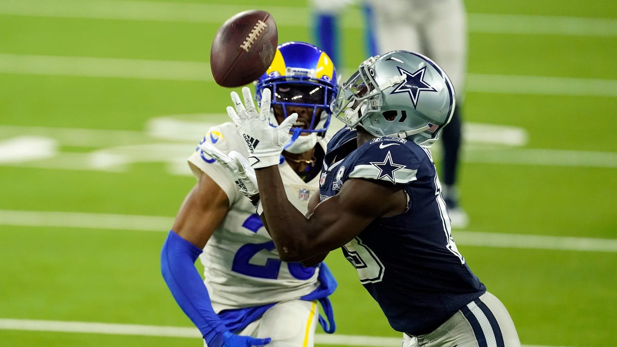 Dallas Cowboys wide receiver Michael Gallup, right, makes a catch but is called for offensive pass interference on Los Angeles Rams' Jalen Ramsey during fourth quarter.