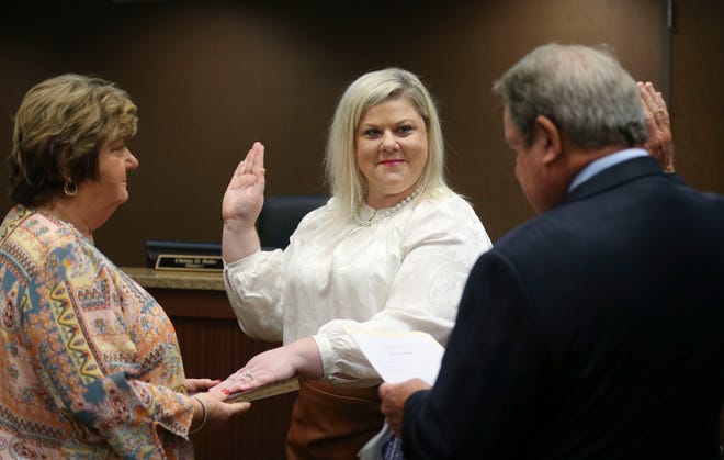 Northport District 1 Councilwoman Christy Bobo has been charged with first-degree theft stemming from an ongoing civil lawsuit involving the estate of her late parents. Bobo, seen here taking the oath of office in September 2020, has denied the accusation. [Staff File Photo/Gary Cosby Jr.]