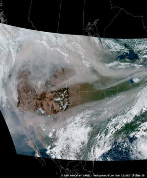 A satellite image showing smoke from wildfires on the West Coast spreading across the country by the jet stream. Officials say the high level smoke is the cause of the hazy, cloudless skies and more colorful sunsets in Indiana.