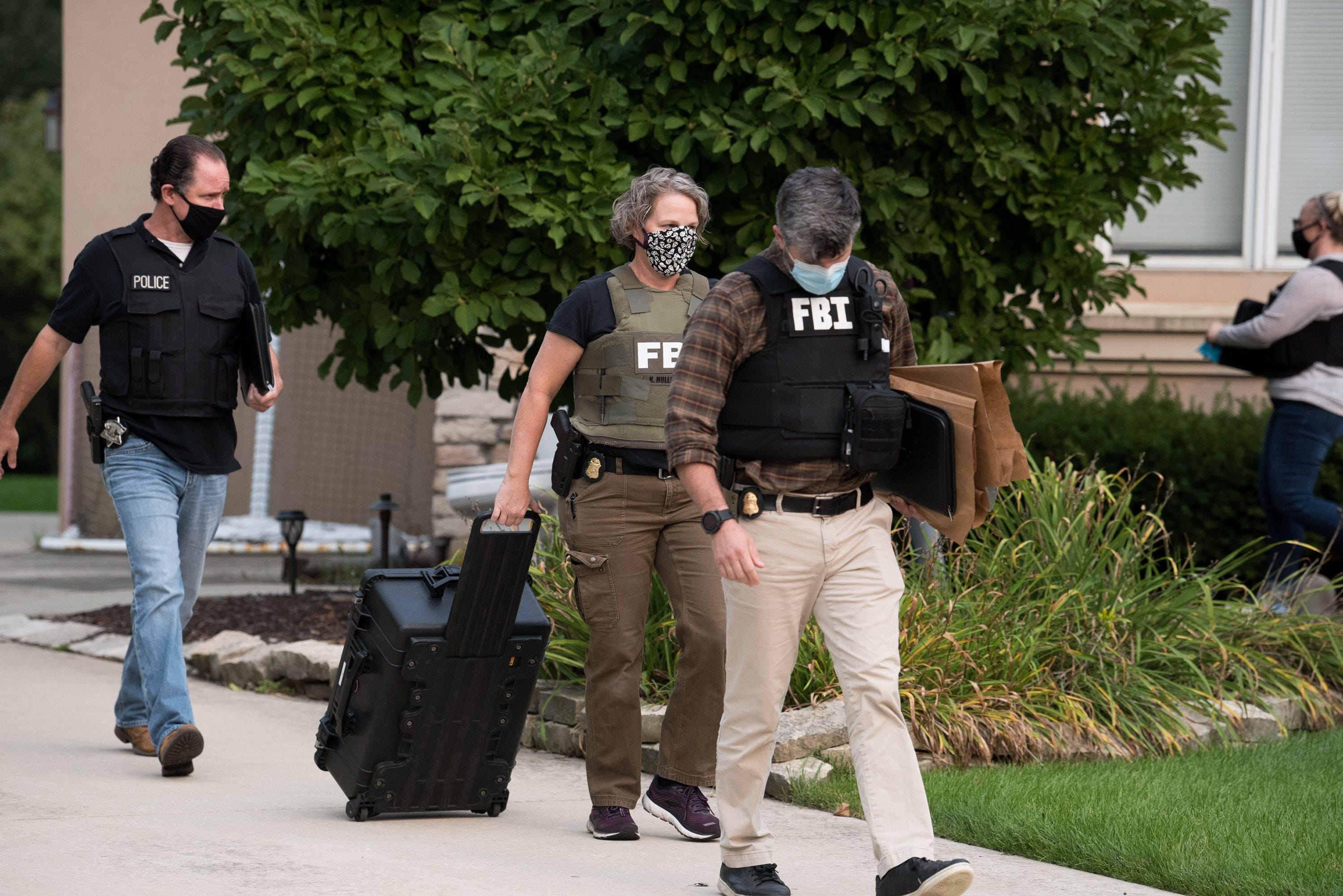 FBI executes a search warrant at a home in Naperville, Illinois. on Sept. 14, 2020. The search is part of an investigation into allegations that Netflix "Cheer" star Jerry Harris solicited nude photos and sex from minors.