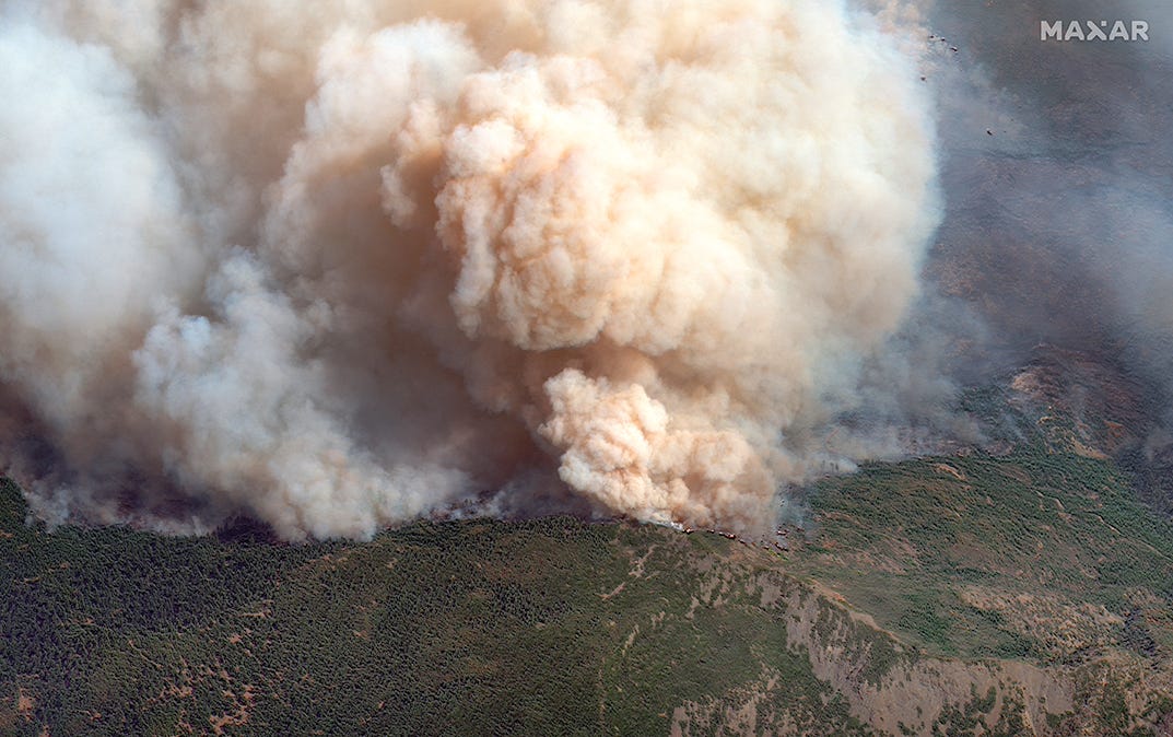 A satellite image of the August Complex wildfire shows an extensive line of fires burning to the north of Big Signal Peak.