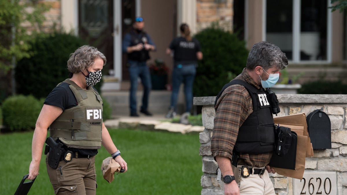 FBI executes a search warrant at a home in Naperville, Illinois. on Sept. 14, 2020. The search is part of an investigation into allegations that Netflix "Cheer" star Jerry Harris solicited nude photos and sex from minors.