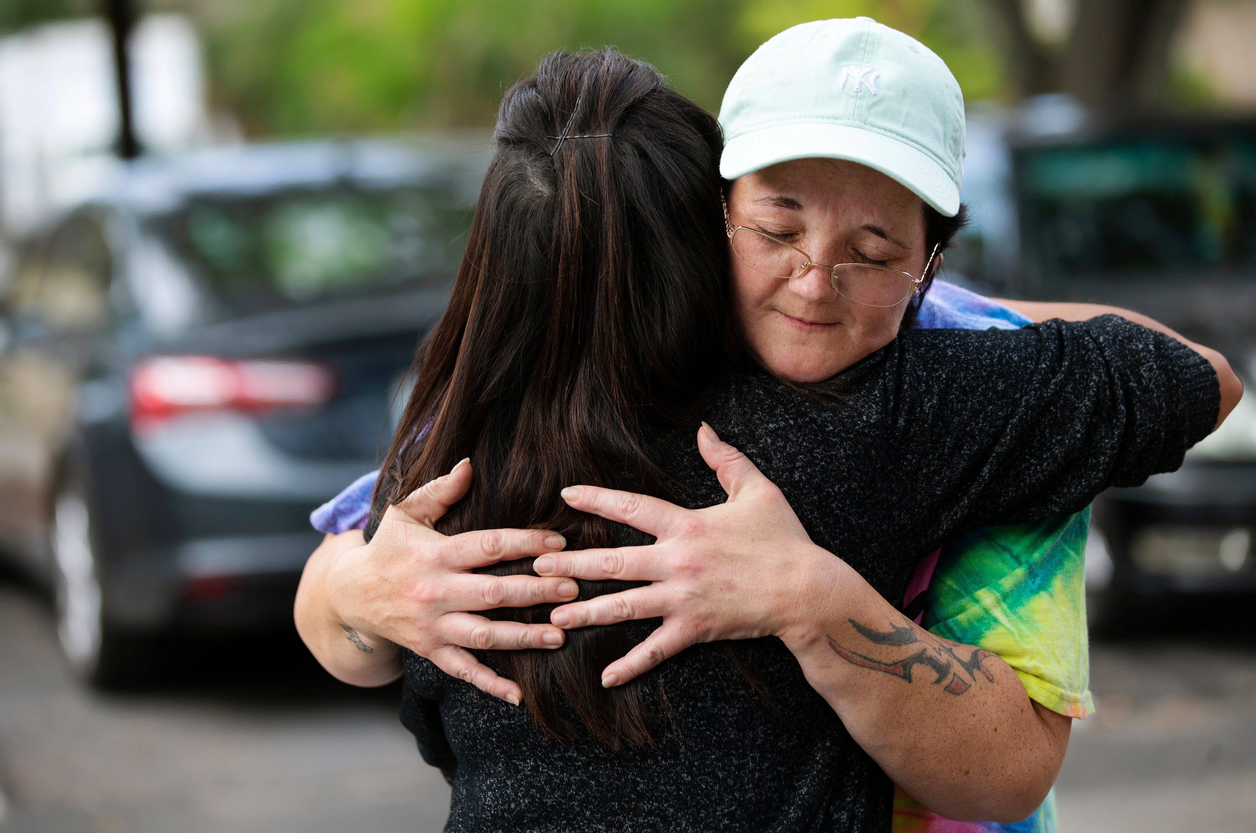 "Thank you so much for helping," Kyrstal Hartman, facing, told Isis LaRose, of Better Together, moments after Hartman's toddler son Jack went to live with a Better Together host family in May.