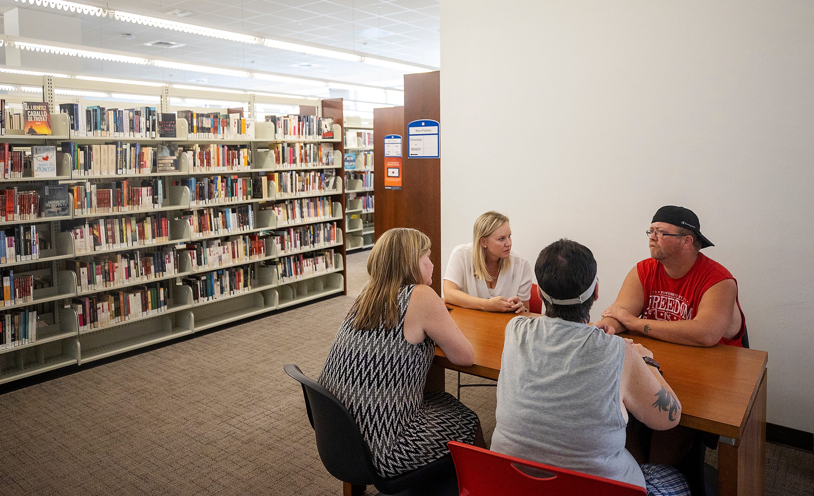 Kyrstal Hartman, front right, and Jack's father, Jason Davis, right, shared their life challenges with Selena Hinsdale and Megan Rose, of Better Together, during a visit at a local library in May. "We're here for you," Hinsdale told the couple.