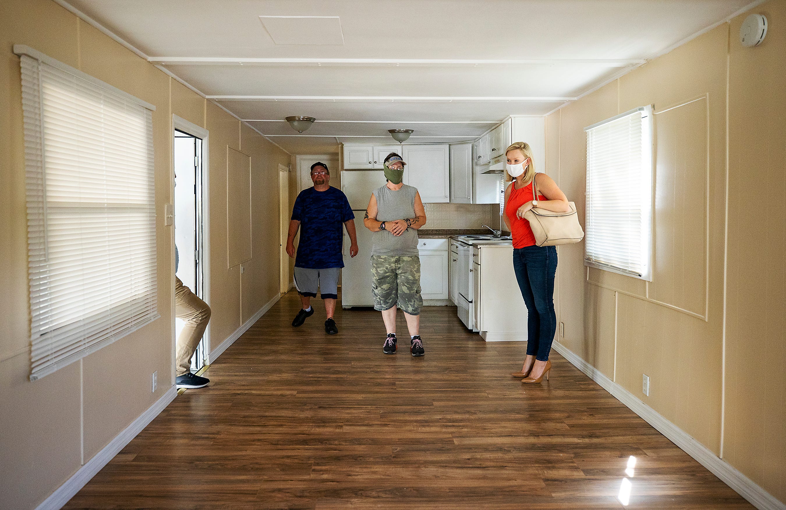 Megan Rose, right, of Better Together, helped Jack's parents, Kyrstal Hartman and Jason Davis, search for a home in July.