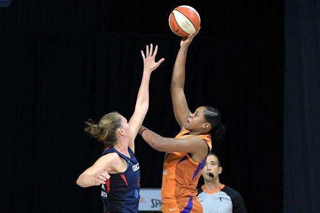 Phoenix Mercury center Kia Vaughn, right, goes up for a shot in front of Washington Mystics guard Emma Meesseman, left, during the first half of a WNBA basketball first-round playoff game, Tuesday, Sept. 15, 2020, in Bradenton, Fla. (AP Photo/Phelan M. Ebenhack)
