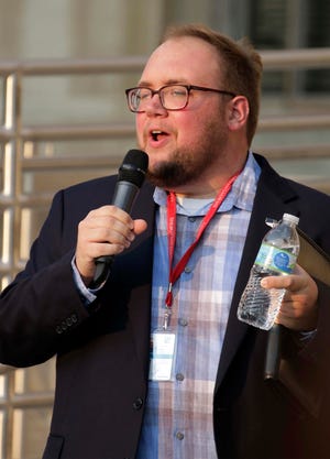 County Supervisor Jacob Immel of the 18th district speaks to the crowd during the Freedom Rally in front of the Sheboygan County Courthouse, Tuesday, September 15, 2020, in Sheboygan, Wis. Immel told the crowd he was against the proposed resolution.