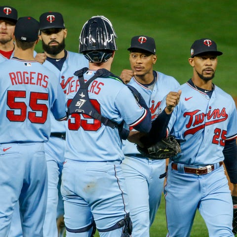 Twins players celebrate a win against the Indians.