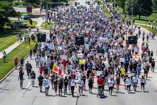 Marchers rally in Omaha, Nebraska, on June 7 to remember James Scurlock, a Black man who was fatally shot by white bar owner Jake Gardner amid protests over George Floyd's death. (Chris Machian/Omaha World-Herald via AP)