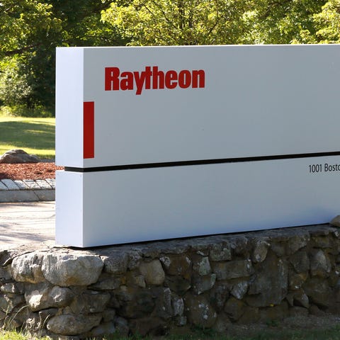 A sign stands at the road leading to the Raytheon 