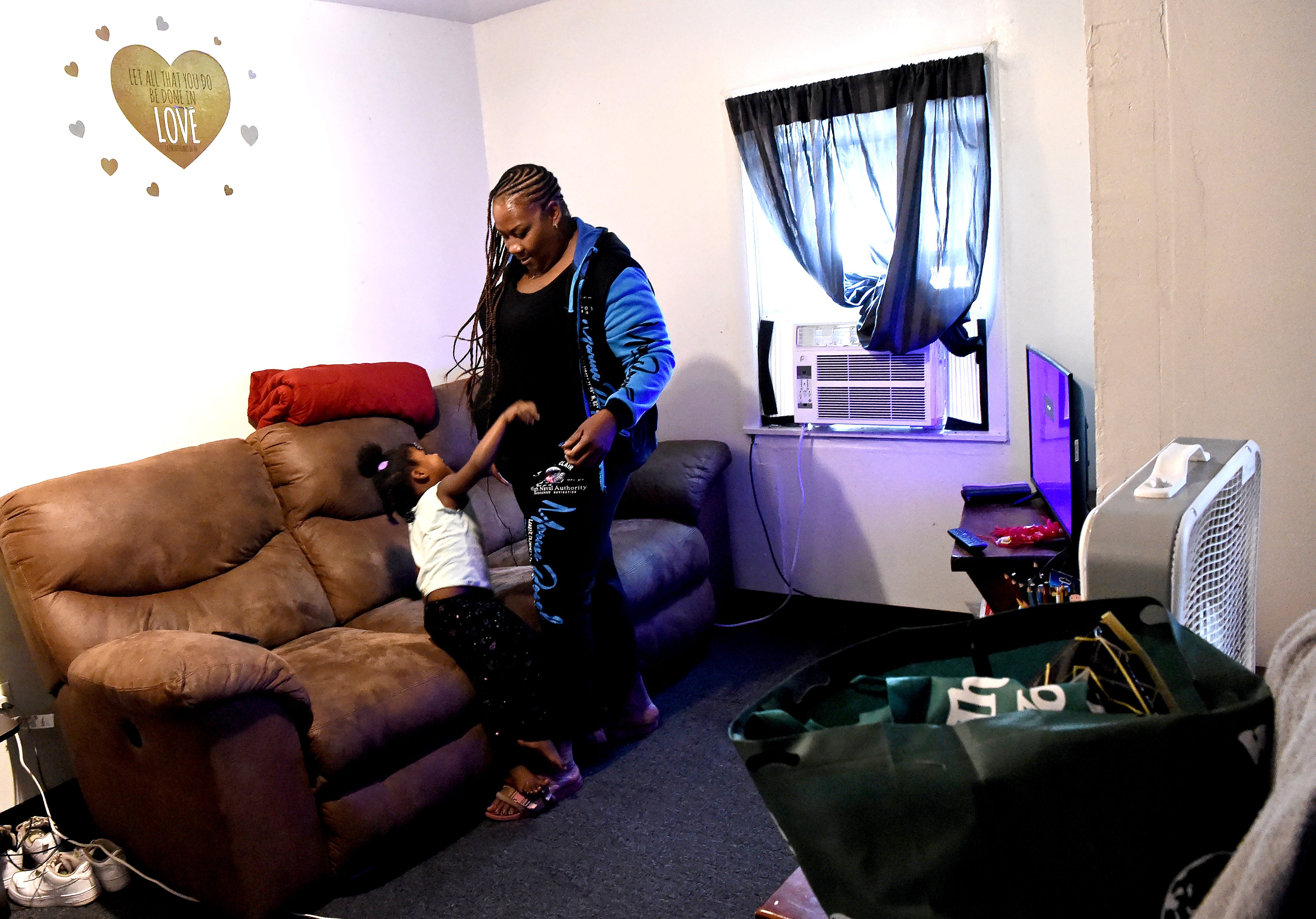 Davita Bateman with her granddaughter Phoenix Barnett in the family's Binghamton home. Bateman's two school-age children are balancing a combination of in-person and remote learning for the academic year, while Phoenix is enrolled in remote preschool. Tuesday, Sept. 15, 2020.