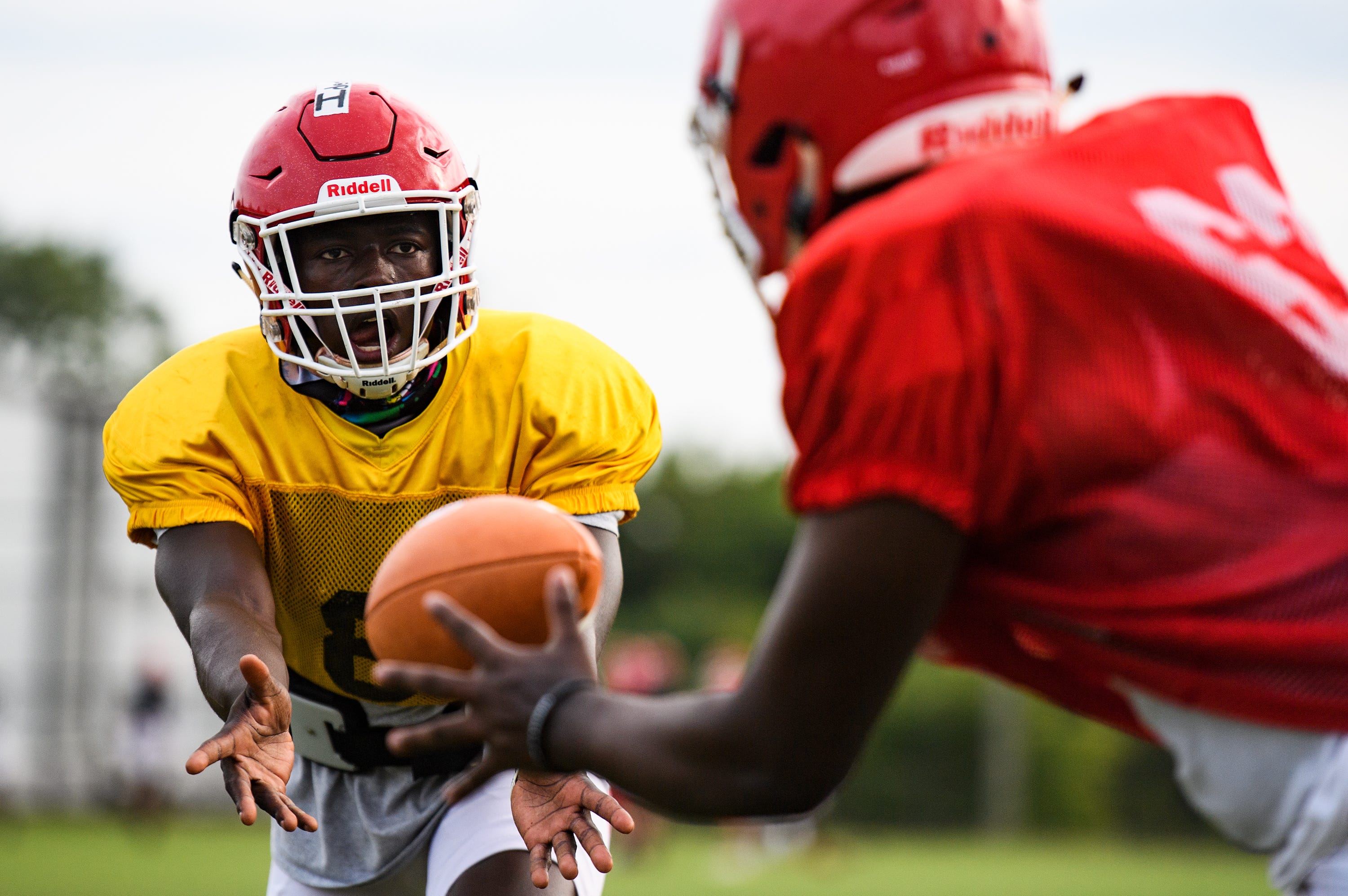 Greenville High School football players run through plays during practice Tuesday, Sept. 15, 2020.