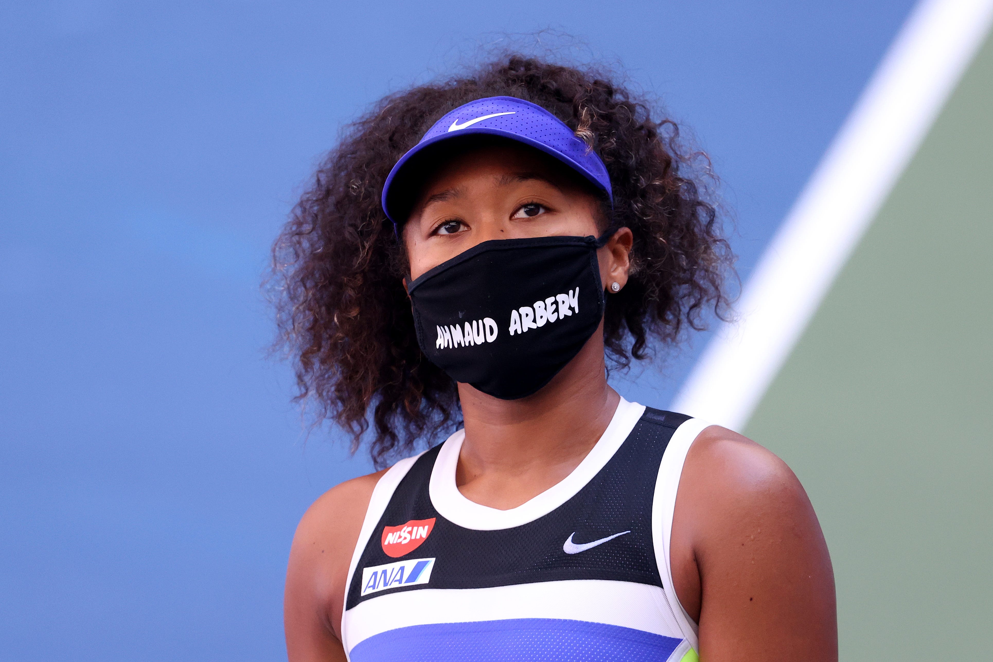 Naomi Osaka wears a protective face mask with the name of Ahmaud Arbery stenciled on it at the 2020 U.S. Open on Sept. 4, 2020 in New York City. Arbery was an unarmed 25-year-old Black man who was fatally shot this year while jogging in Glynn County, Ga.