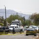 Law enforcement works the scene of a shooting near 37th Avenue and Portland Street in Phoenix on Sept. 17, 2020.