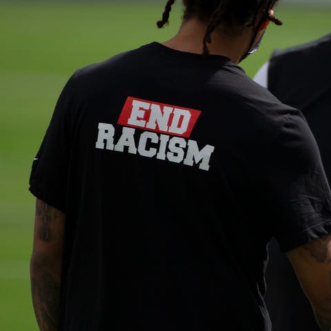 The 'End racism' shirt was designed by Houston Tex