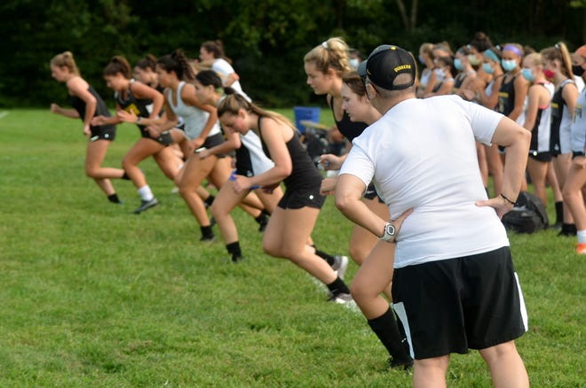 Moorestown freshman coach Steph Allocco sends a group of senior off during a 'beep test' at a preseason practice. Soccer is part of the high school gym curriculum, but Teen Takes panelist Clare Socolow wishes gym class could stay more fitness, rather than sports, focused.