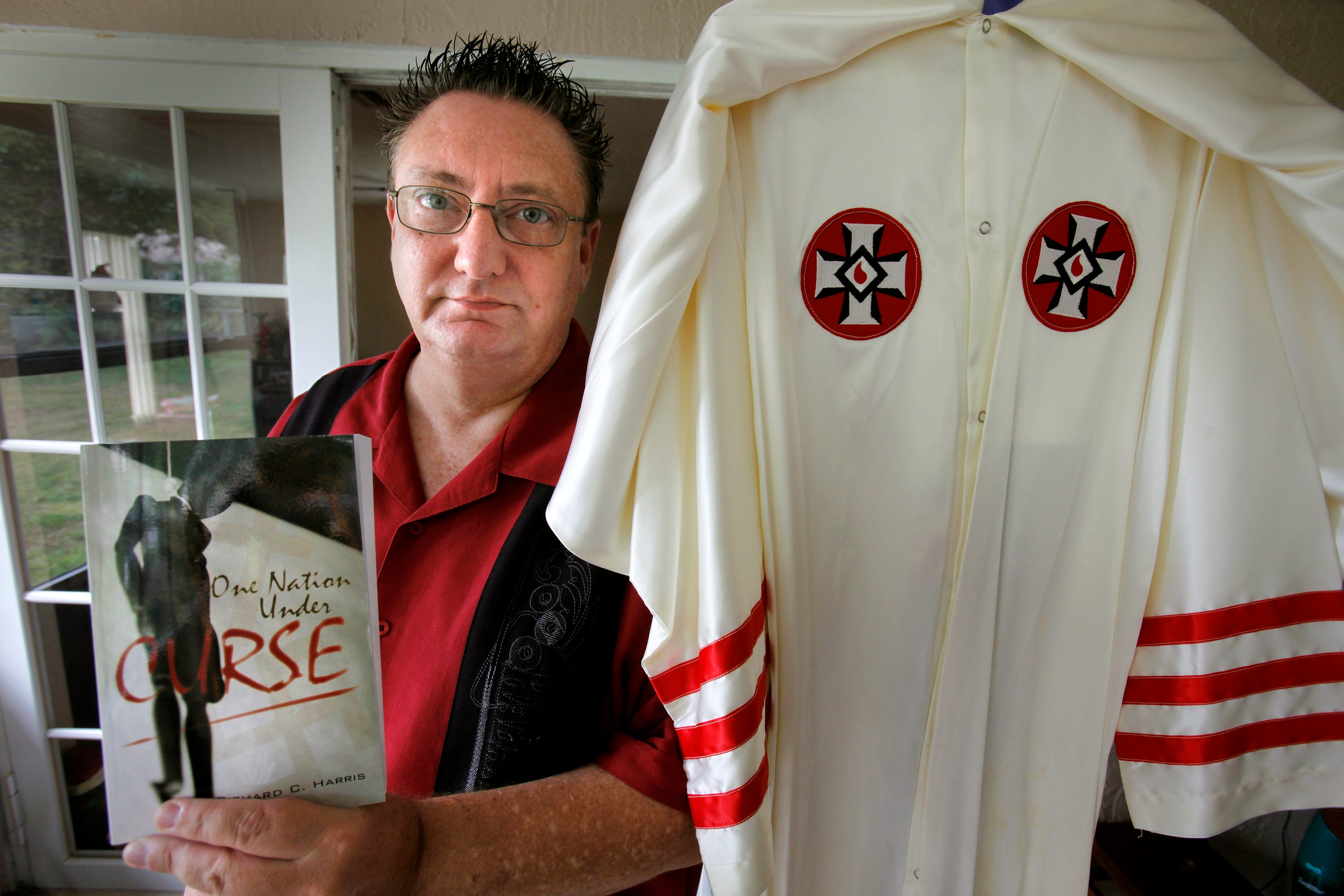Richard Harris wrote a book about his days as a member of the KKK in Indiana and how he was called to his religious faith, "One Nation Under Curse." Pictured is one of his Klansman robes.