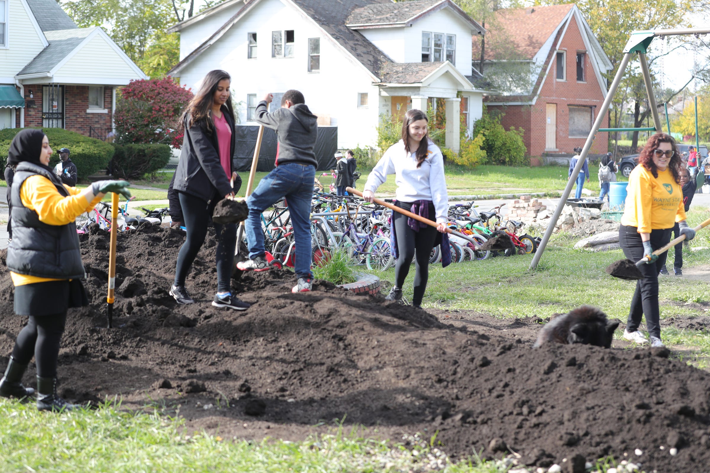 Volunteers work on a play scape during the community bazaar put on by Sonia Brown also known as Auntie Na Saturday, October 19, 2019 in Detroit, Mich.