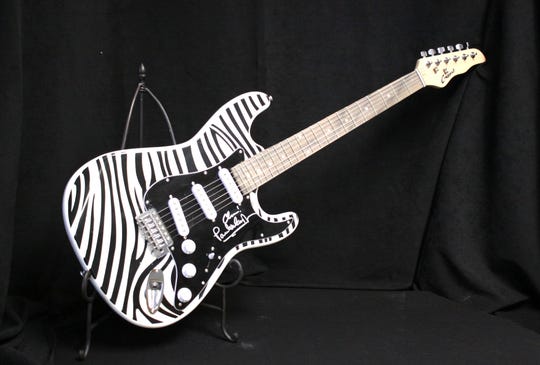 Paul McCartney and Beatles fans will want to bid on McCartney’s zebra-striped, signed guitar that was played during his June 8, 2019, concert, at Lambeau Field.