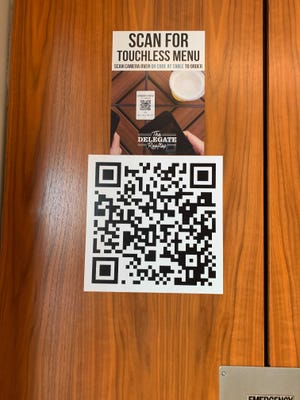 Get used to using your phone to check out menus the next time you stay at a hotel.