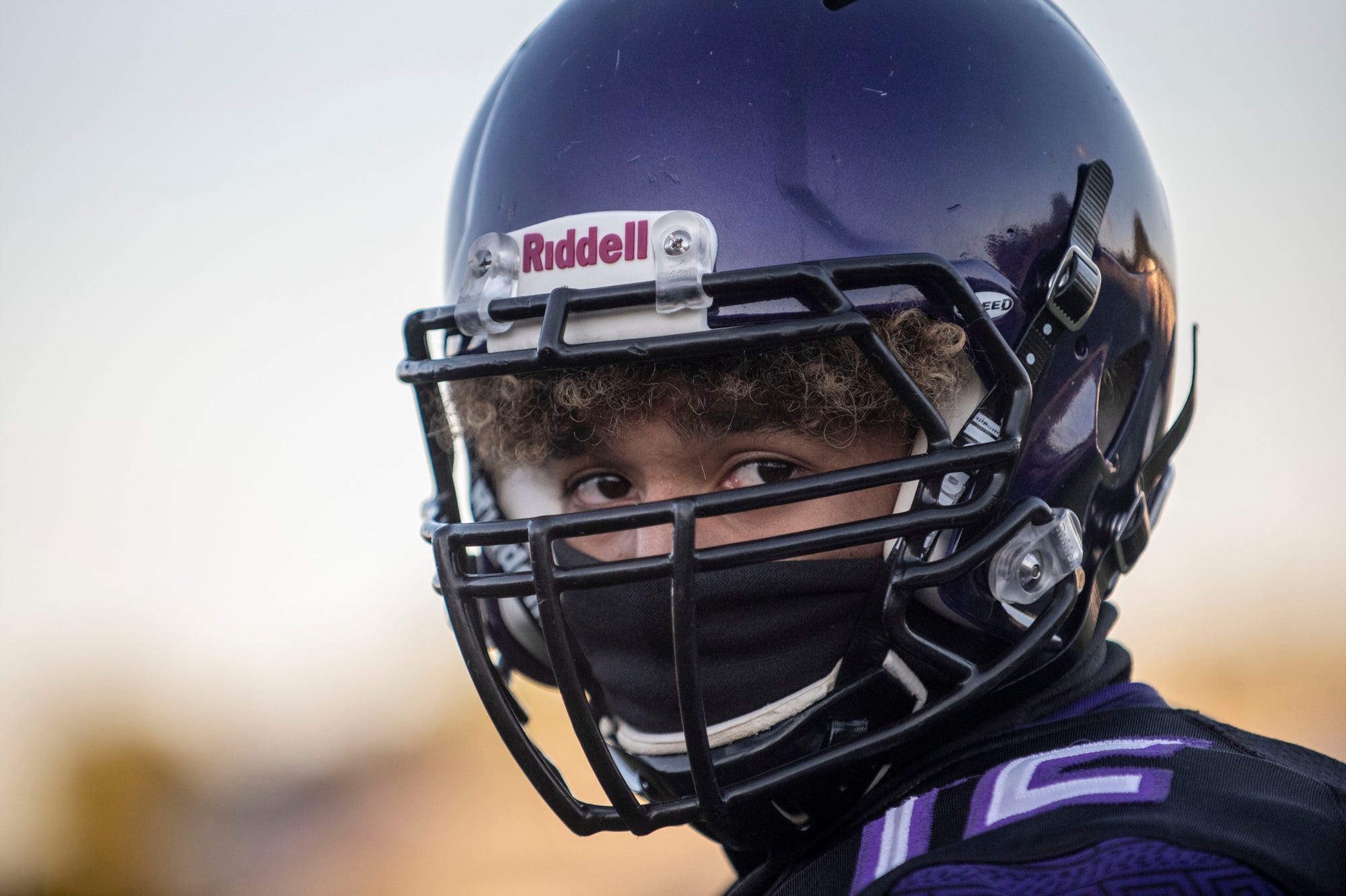 High school players, coaches adjust to football while wearing a mask