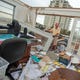Joseph Mirabile goes through his office Saturday, September 19, 2020 at Terra Firma Asset Management in Perdido which was destroyed by Hurricane Sally.