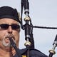 Former Chandler swim coach Kerry Croswhite, who played bagpipes for his swimmers as they were introduced during the finals at state meets, died this summer from COVID-19. Arizona Republic photo