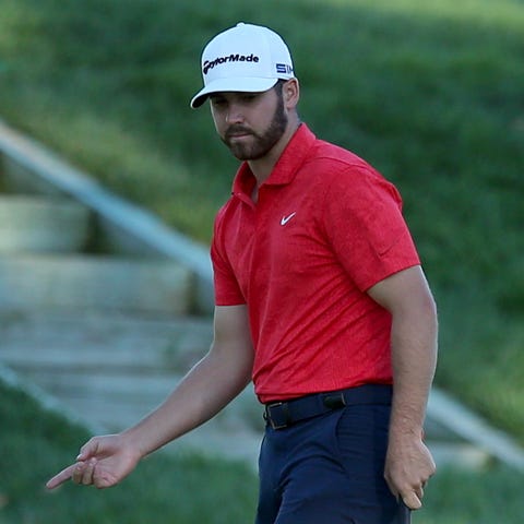 Matthew Wolff reacts to his putt on the 16th green