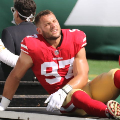 An injured Nick Bosa is carted off the field  in t