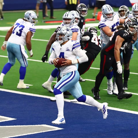 Dallas Cowboys quarterback Dak Prescott (4) runs t