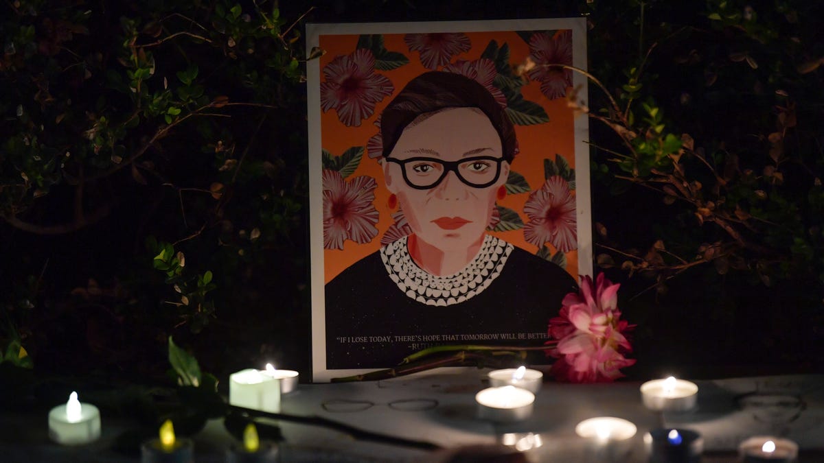 An illustration of Ruth Bader Ginsburg is displayed during a candlelight vigil outside the U.S. Supreme Court building in Washington, D.C. honoring the legacy of Justice Ruth Bader Ginsburg on Saturday, September 19, 2020.