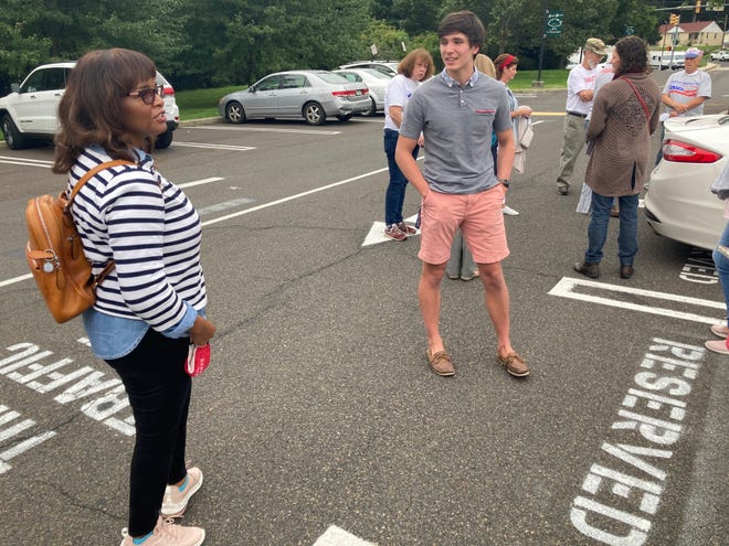 Kathy Barnette talks to Wes Wedell, 22, of Huntington Valley, who is taking off from a semester at the University of Pennsylvania to help with her campaign.