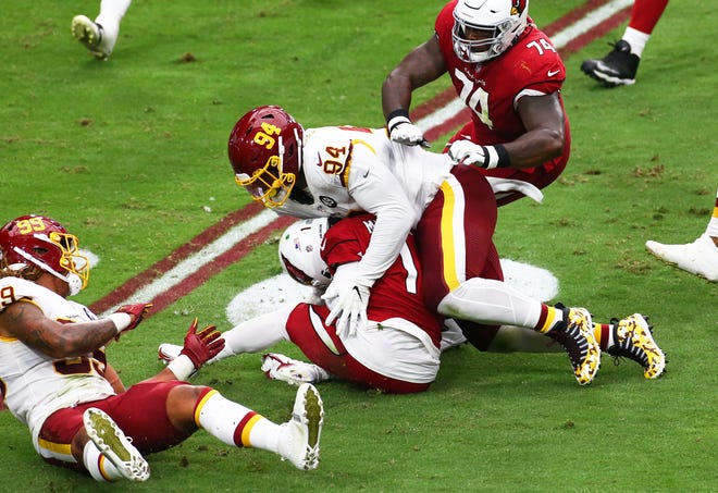 Washington Commanders nose tackle Daron Payne (94) dismisses Arizona quarterback Kyler Murray during a 2020 game in Glendale, Ariz.  Payne and the rest of the Commanders defensive line will put a tremendous test on the revised Jaguars offensive line on Sunday.