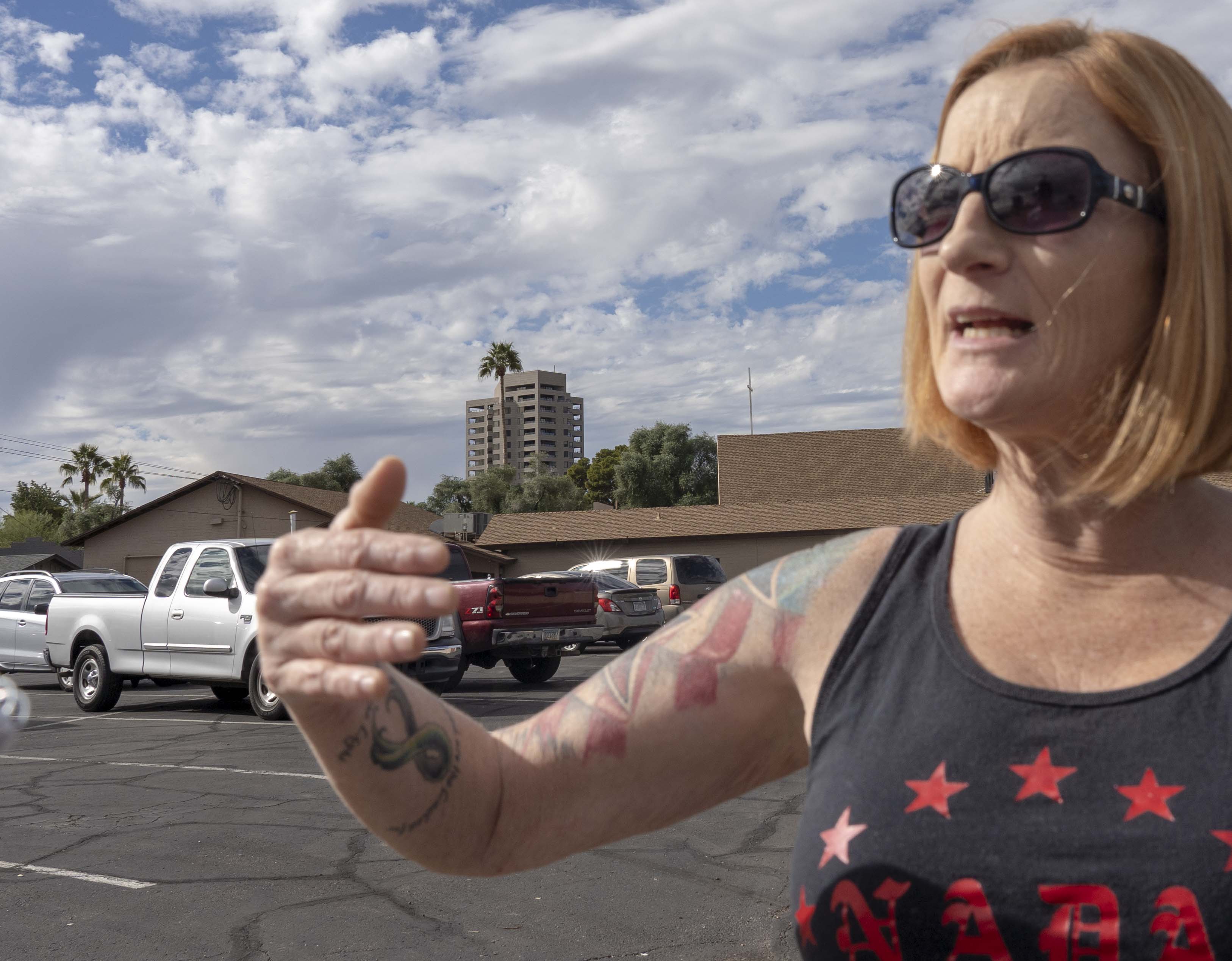 Lesa Antone, of the Patriot Movement AZ, protests outside a Phoenix-area church on Jan. 10, 2019.