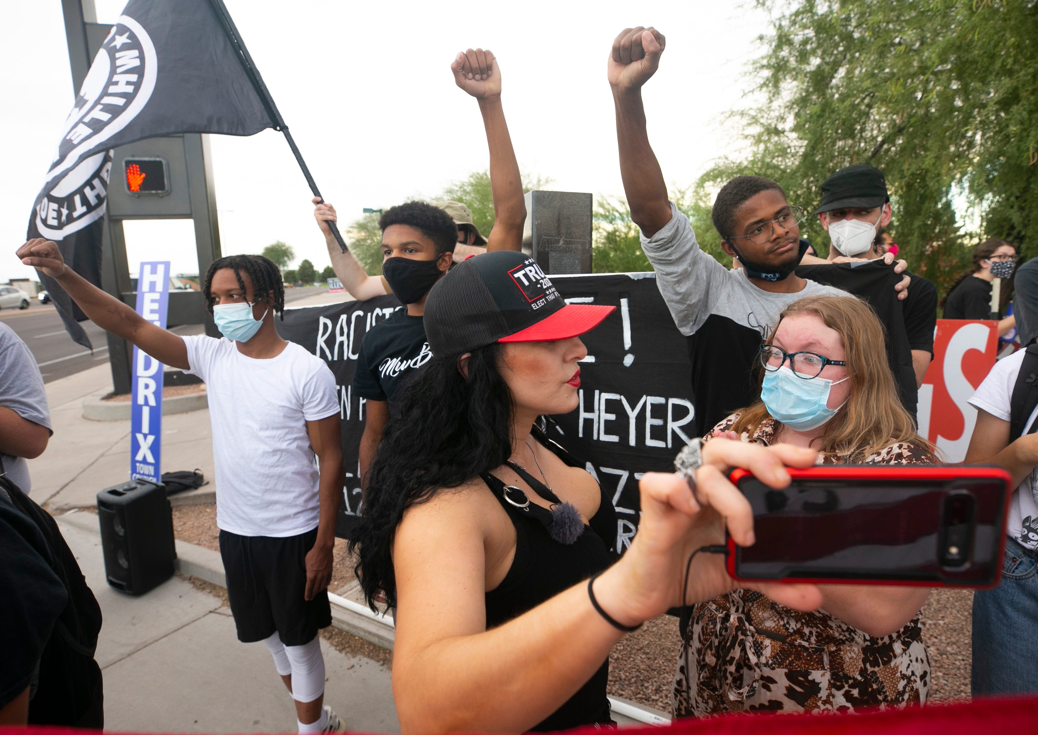 Jennifer Harrison of AZ Patriots argues with Blacks Lives Matter supporters and counter protesters at an organized pro-police "Support the Blue" rally in Gilbert on Aug. 13, 2020.