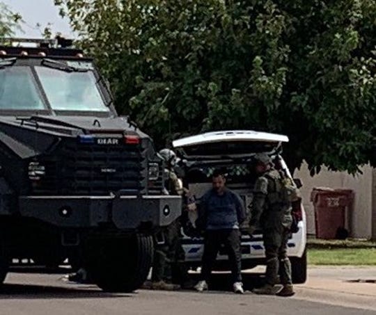 Police say a man barricaded himself in someone else's Scottsdale home following a car crash near McKellips and Scottsdale roads on Sept. 21, 2020.