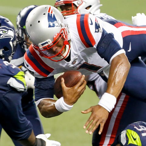 Patriots quarterback Cam Newton, airborne against 