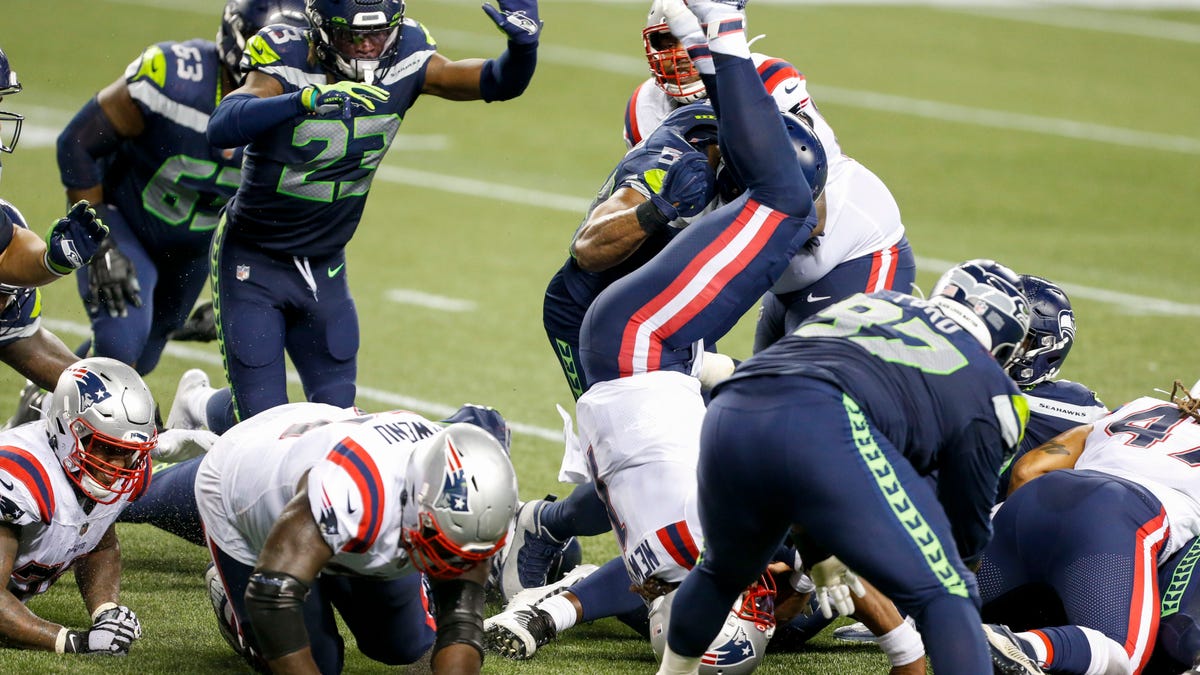 New England Patriots quarterback Cam Newton (1) is tackled shy of the goal line for the final play of a 35-30 loss against the Seattle Seahawks at CenturyLink Field.