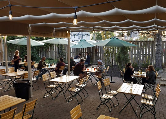 Patrons enjoy the patio under a tent at Gemut Biegarden in Columbus September 21, 2020. Restaurants are starting to adapt patios for the temperatures as they begin to drop.