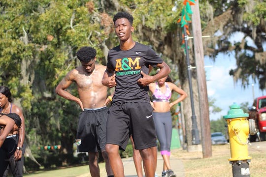 FAMU sprinter Brandon Love takes a break after running with teammates. The Miami native is presently enrolled in the NFL Events & Club Business Development Experienceship Program.