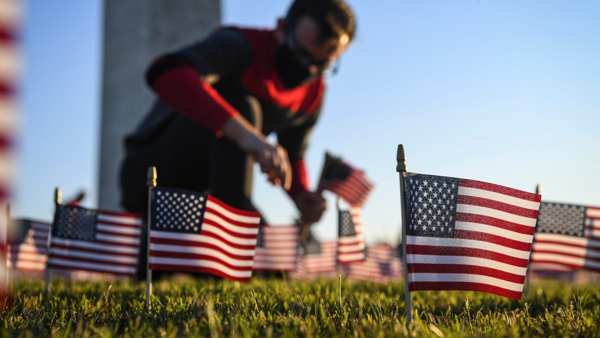 Some of the 20,000 American flags placed by COVID Memorial Project volunteers to memorialize the 200,000 deaths due to COVID-19 Milestone on the National Mall on Sept. 21, 2020.
