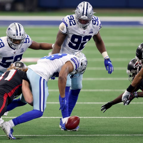 C.J. Goodwin of the Dallas Cowboys recovers an ons