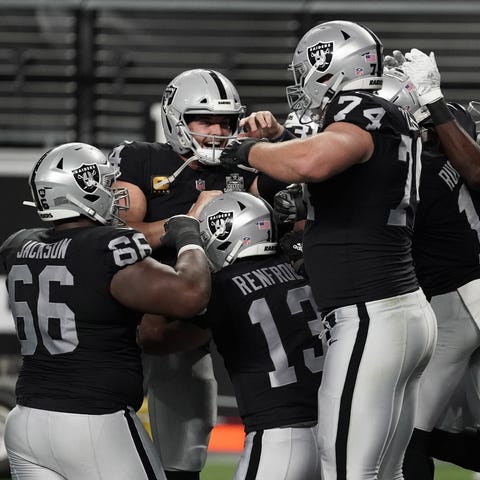 Las Vegas Raiders players celebrate a touchdown by